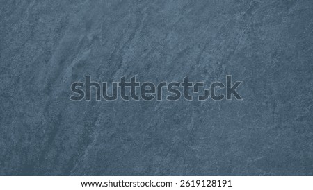 Abstract blue gray texture background, rough old surface is covered with cracks and has a rough structure