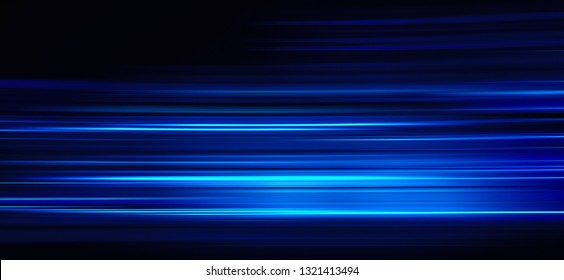 Abstract blue light trails on the dark background