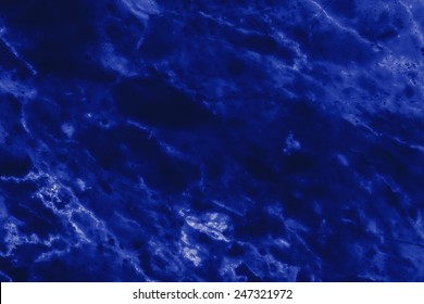 Abstract blue marble patterned texture background.