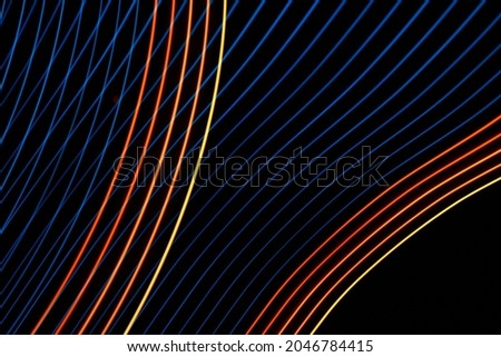 Abstract blue and orange lights. Lightpainting photography. Effects made with light.