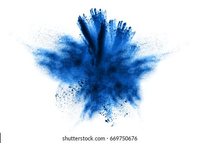 Abstract blue powder explosion on white background. Closeup of  blue dust particles splash isolated on  clear background.