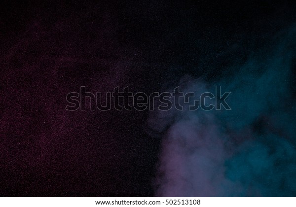 Abstract blue purple water vapor on a black\
background. Texture. Design elements. Abstract art. Steam the\
humidifier. Macro\
shot.