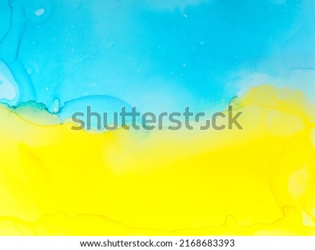 Abstract blue and yellow fragment of colorful background, wallpaper. Mixing acrylic paints. Modern art. Marble texture. Alcohol ink colors translucent. Alcohol Abstract contemporary art fluid.