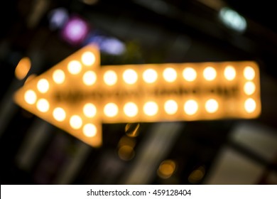 Abstract Blur Of Arrow Sign Made By Light Bulb