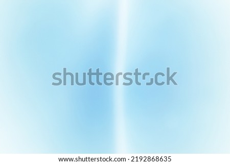 Abstract blur background in blue and white from a defocused photo with space for runaround or wraparound text 
