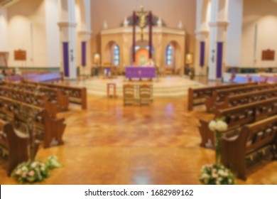 Abstract Blur Background Of Empty Catholic Church Interior.