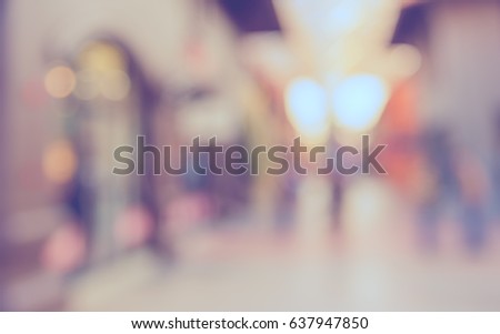 Abstract blur background image of steet  shopping mall with vintage tone look.
