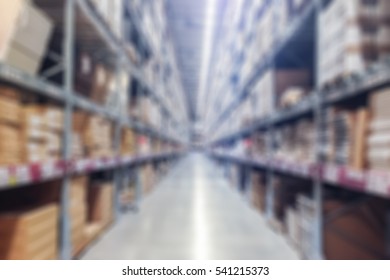 Abstract blur background of inside of warehouse with aisle pallet on high shelf