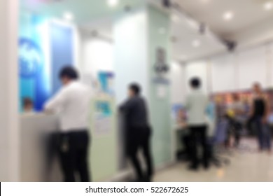 Abstract Blur Background Of People Crowd In Bank Counter, Urban Lifestyle Concept.