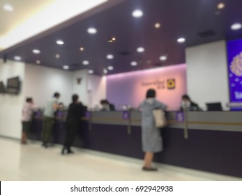 Abstract blur background of people crowds the bank counter, urban lifestyle concept,Queue or waiting bank counter.