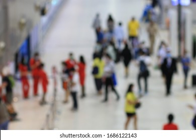 Abstract Blur Background : People Walking In The Terminal At Airport Check-In Counters With Passengers Some One Arrival Some In Their Trip. No More People With Bokeh During Covid 19 Virus.