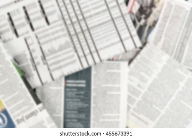 Abstract Blur Background Of Pile Of Newspaper.