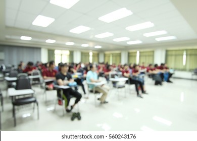 Abstract Blur Background Of Student During Study, Quiz, Test, Exams From Teacher In Lecture / University Classroom /Speaker At Business Workshop And Presentation. Audience At The Conference Room.