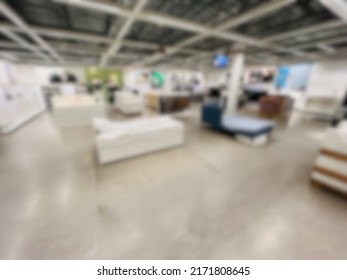 Abstract Blur Background Of Warehouse Retail Space.