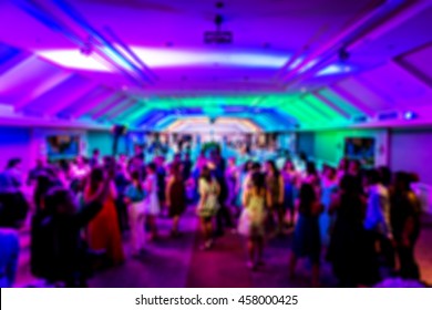 abstract blur background of wedding after party at night with nightclub style