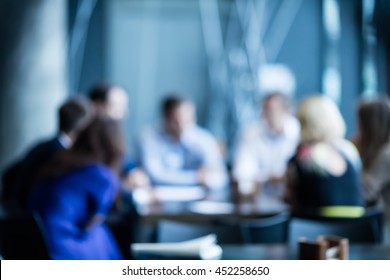 Abstract Blur Business Meeting, Business, Press, News And People And Concept - Close Up Of Young Smiling Businessman Reading Newspaper Over Office Building