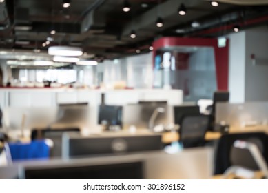 Abstract Blur Business Office Working Space Background With Modern Interior Table And Chair With Devices. Blurry Creative Workplace Design Background. Laptop And Mouse