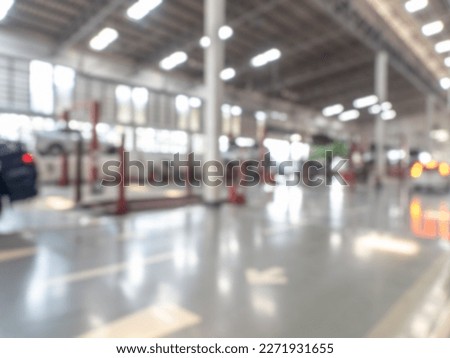 Abstract blur car garage automobile interior. Blurred mechanic service centre auto repair workshop, soft defocused. Blurry car care station background.