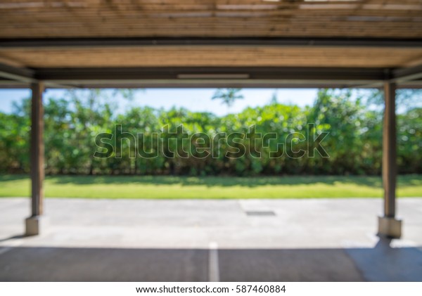 Abstract\
blur car parking lot in garden bokeh\
background