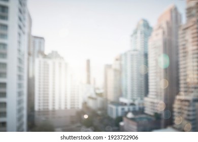 Abstract Blur City Estate Buildings In Morning View Background. Cityscape Skyline From Top Office Window View. Blurred Outside Bokeh Real Architecture Modern Company Construction Town Morning Outdoor.