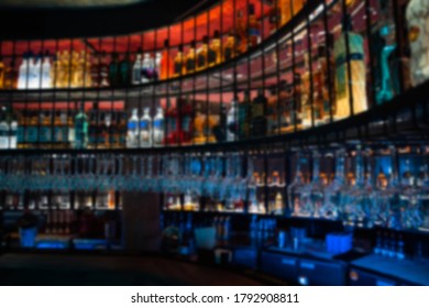 Abstract Blur Of Clean Glasses That Hang Above A Bar Counter.