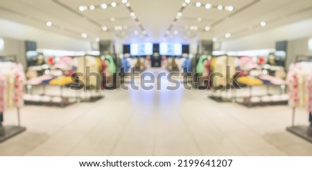 Abstract blur clothing boutique display interior of shopping mall background