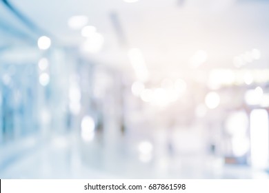abstract blur contemporary office interior blue background with orange light filter effect 