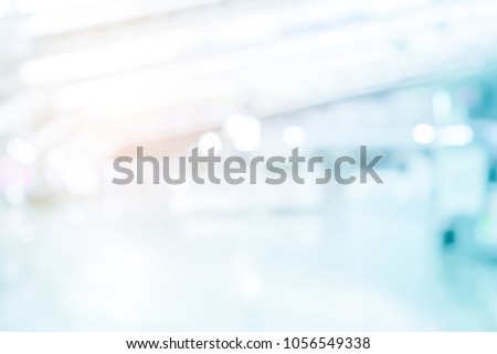 abstract blur contemporary office interior blue background with orange light filter effect for design as ppt presentation and banner ads wallpaper concept