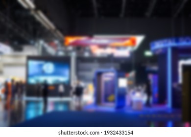 Abstract Of Blur Crowd And Lights In Exhibition Hall Background Of Department Shopping Mall, Blurred Soft Of People In Business Office Walking Through Building, Technology Market Expo Exhibition Event