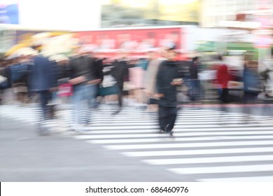 Abstract Blur Crowd People On Crosswalk At Shibuya Town In Tokyo, Japan