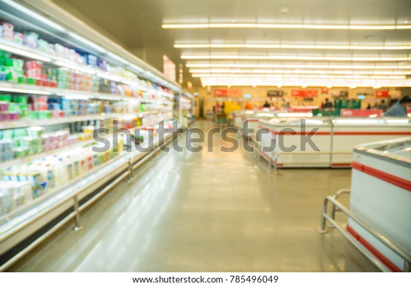 Abstract Blur Defocus Background of Dairy Product\
Shelf in Hypermarket or Supermarket Retail Store Outlet as Modern\
Lifestyle Concept
