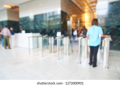 Abstract Blur Or Defocus Background Of People Use Employee Id To Enter Security Door In Modern Building Gate As Modern Office Working Lifestyle