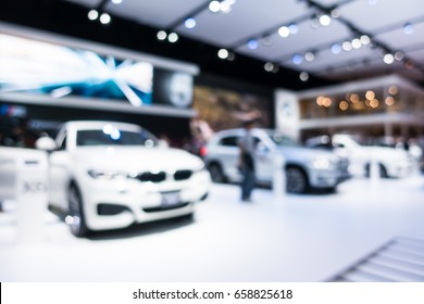 Abstract blur and defocused car and motor exhibition show interior for background