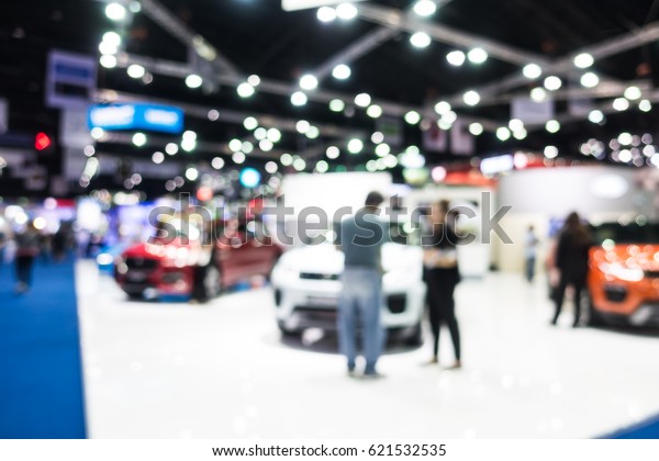 Abstract blur and defocused car and motor\
exhibition show interior for\
background