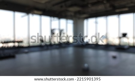 Abstract blur and defocused sport equipment in gym interior for background.