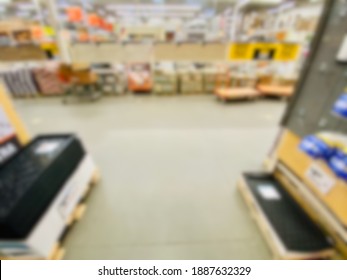 Abstract Blur Of Empty Big Box Store Walkways.￼