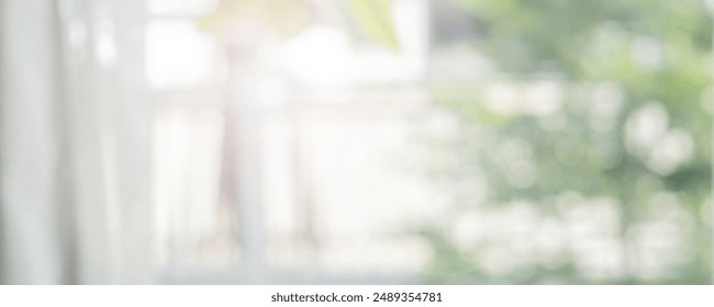 abstract blur garden view from window in the living room with morning light for background concept - Powered by Shutterstock