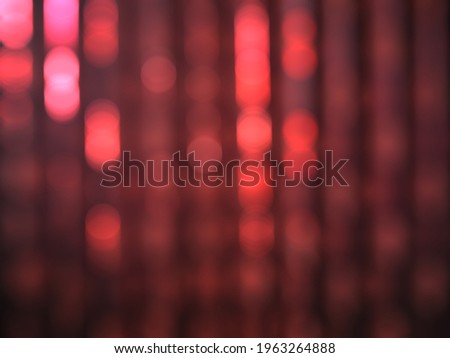 Abstract blur image background of red curtain in the hotel with bokeh light bulb, Interior hotel, defocused.