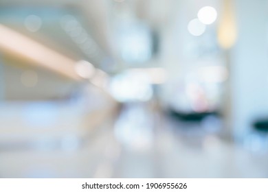 abstract blur image background of shopping mall with light bokeh and flare light bulb