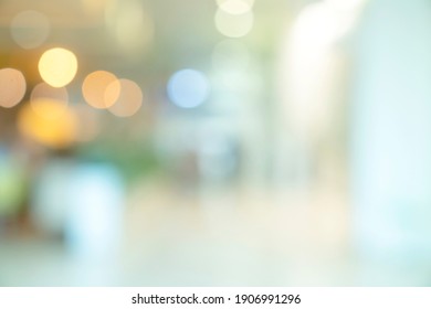 abstract blur image background of shopping mall with light bokeh and flare light bulb