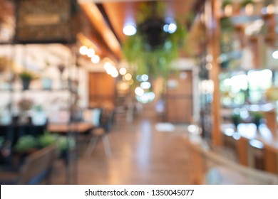 Abstract Blur Image Of Caffee Shop Or Cafe With Bokeh For Background Usage.