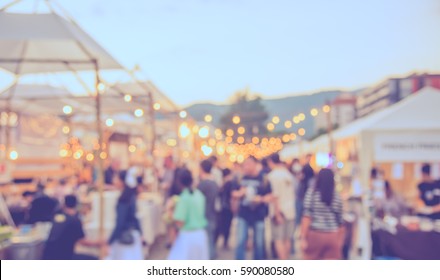 Abstract Blur Image Of Food Stall At Day Festival For Background Usage . (vintage Tone)