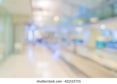 Abstract Blur Image Of Long Corridor In Subway With People For Background Usage .