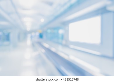 Abstract Blur Image Of Long Corridor In Subway With People For Background Usage .