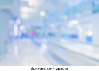 Abstract Blur Image Of Long Corridor In Subway With People For Background Usage .