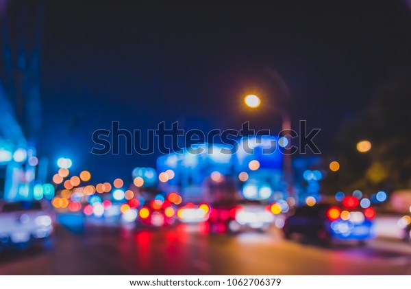 Abstract blur image of Night  light bokeh
on street for background usage. (vintage
tone)