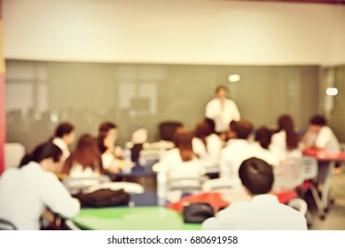 Abstract Blur Image Of People Or Students Lecture In Seminar Room, Facility Morden Workshop. Education Or Training Concept.