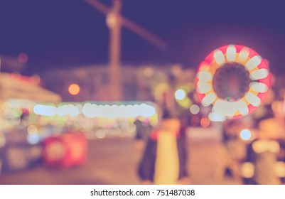 Abstract Blur Image Of Theme Park On Night Time For Background Usage.(vintage Tone)