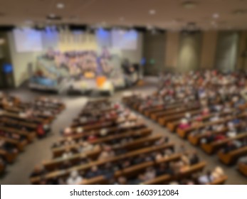 Abstract Blur Of Inside Of Mega Church During Sermon.