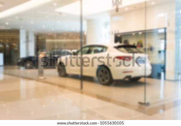 Abstract blur\
Luxury car shop for\
background\
